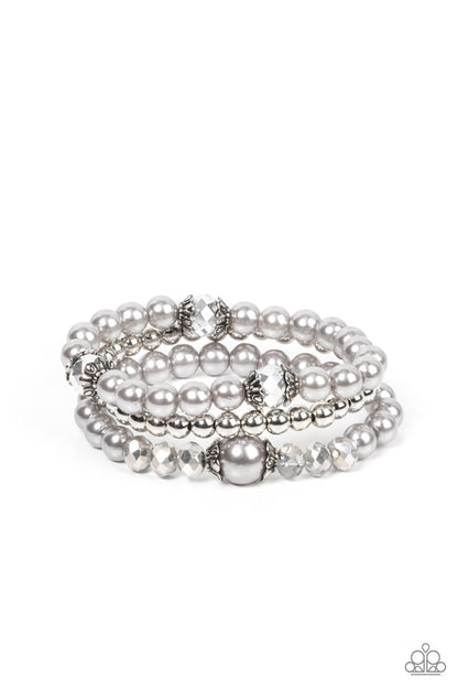 Positively Polished Silver Bracelet - Paparazzi Accessories  Stretchy silver pearl and silver beaded bracelets are adorned with ornate silver accents and glassy hematite flecked crystal-like beads, creating polished layers around the wrist.  Sold as one set of three bracelets.