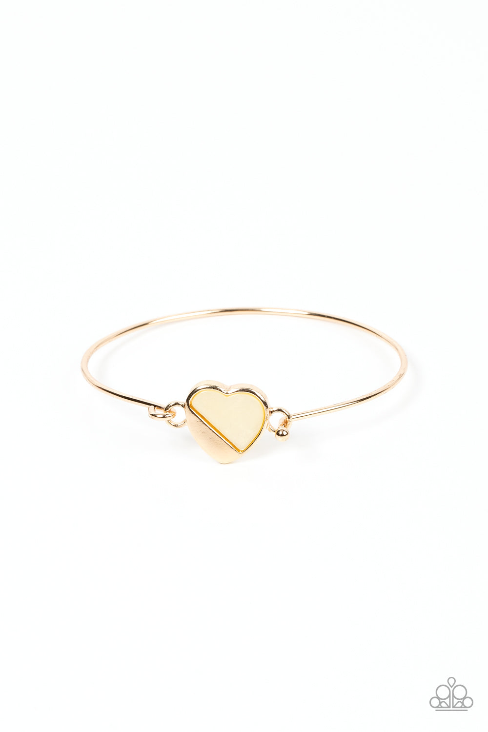 Hidden Intentions Gold Bracelet - Paparazzi Accessories  A glistening gold plate slants across a white shell-like heart charm that delicately hinges to a dainty gold bangle-like bracelet, creating a charming centerpiece around the wrist. Features a barbell closure.  Sold as one individual bracelet.