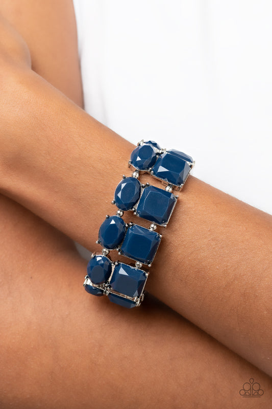 Dont Forget Your Toga - Blue Item #P9ST-BLXX-022XX Separated by pairs of dainty silver beads, faceted stacks of oval and square cut blue beads are threaded along a stretchy band around the wrist for a refreshing pop of color.  Sold as one individual bracelet.