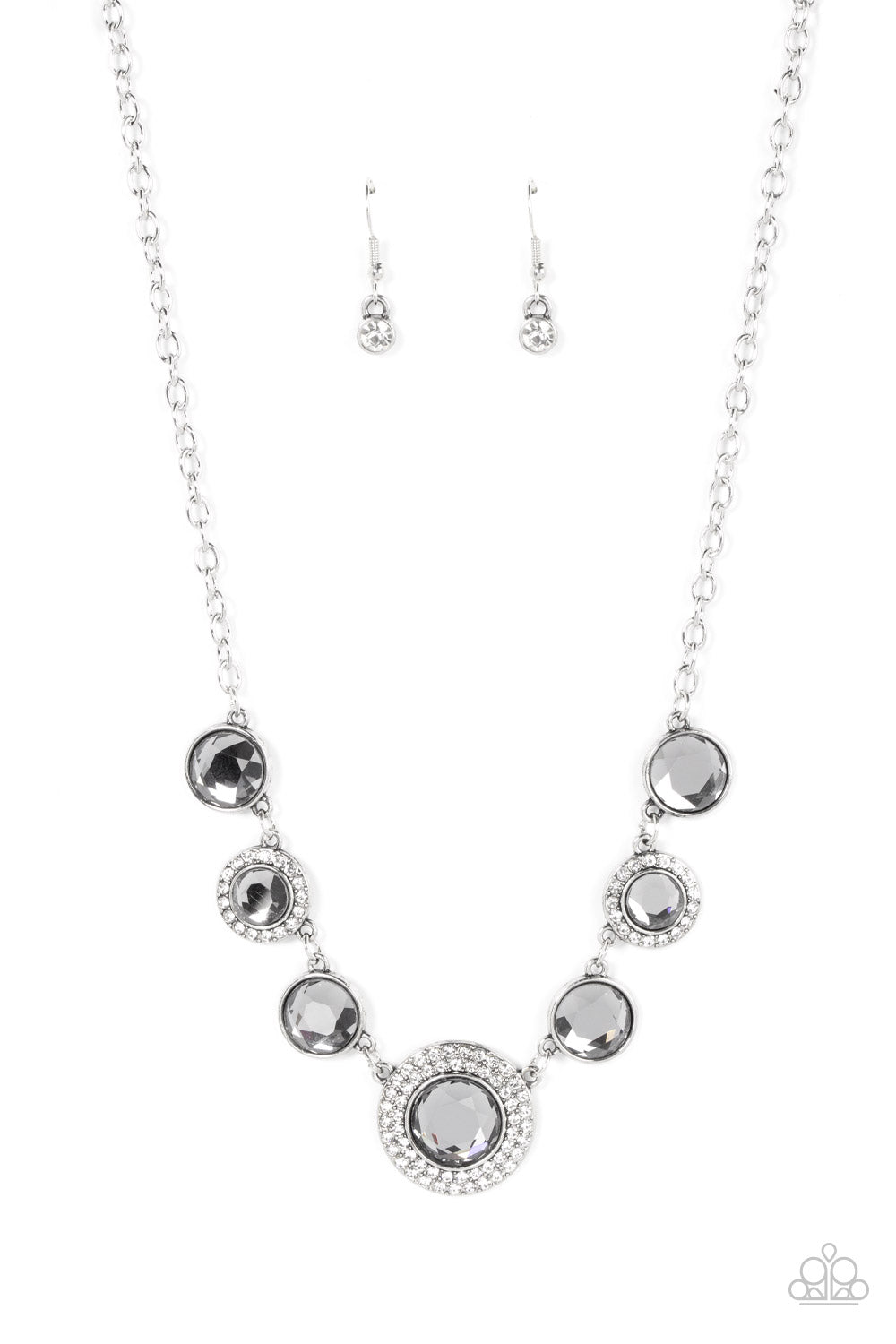 Extravagant Extravaganza Silver Necklace - Paparazzi Accessories  Oversized smoky gems alternate with matching gems bordered in rings of glassy white rhinestones below the collar, resulting in a spellbinding sparkle at the bottom of a classic silver chain. Features an adjustable clasp closure.  Sold as one individual necklace. Includes one pair of matching earrings.