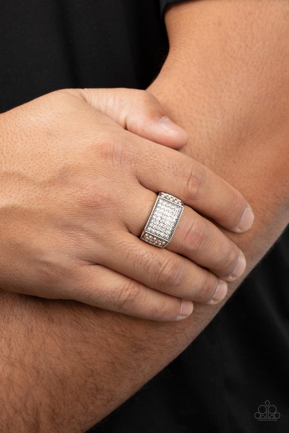 Metro Merger White Ring - Paparazzi Accessories  The front of a rectangular silver frame is encrusted in sections of white rhinestones, resulting in a smoldering centerpiece atop the finger. Features a stretchy band for a flexible fit.  Sold as one individual ring.
