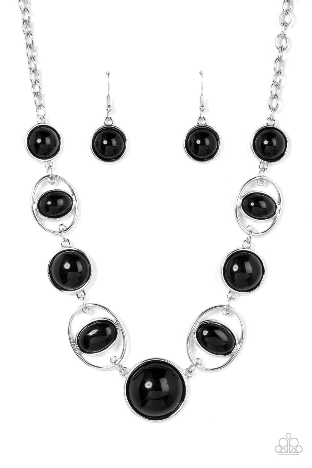 Eye of the BEAD-holder Black Necklace - Paparazzi Accessories  Encased in sleek silver frames, a bubbly collection of oversized black beads alternate with oval black beaded hoops below the collar for a bodacious pop of color. Features an adjustable clasp closure.  Sold as one individual necklace. Includes one pair of matching earrings.