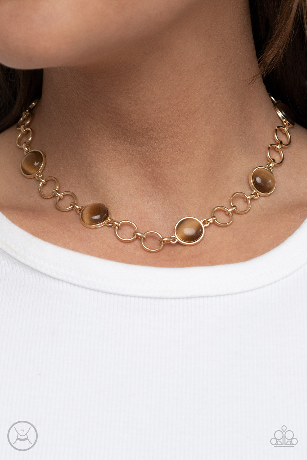 Dreamy Distractions Brown Choker Necklace - Paparazzi Accessories  Pairs of gold hoops and brown cat's eye dotted gold frames delicately link around the neck, creating a dreamy glow. Features an adjustable clasp closure.  Sold as one individual choker necklace. Includes one pair of matching earrings.