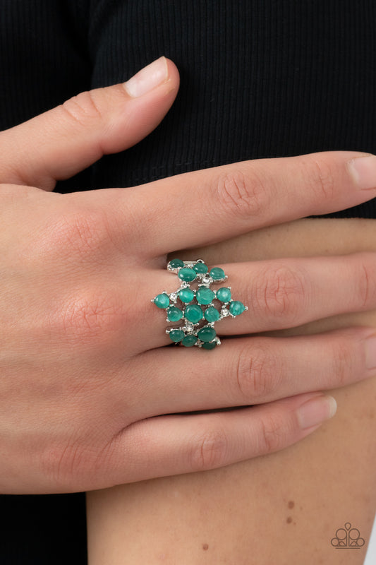 Seeing Eye to Cats Eye Green Ring - Paparazzi Accessories  Featuring pronged silver fittings, a dreamy collection of dainty white rhinestones and bubbly green cat's eye stones scatter across the finger for an enchanting fashion. Features a stretchy band for a flexible fit.  Sold as one individual ring.