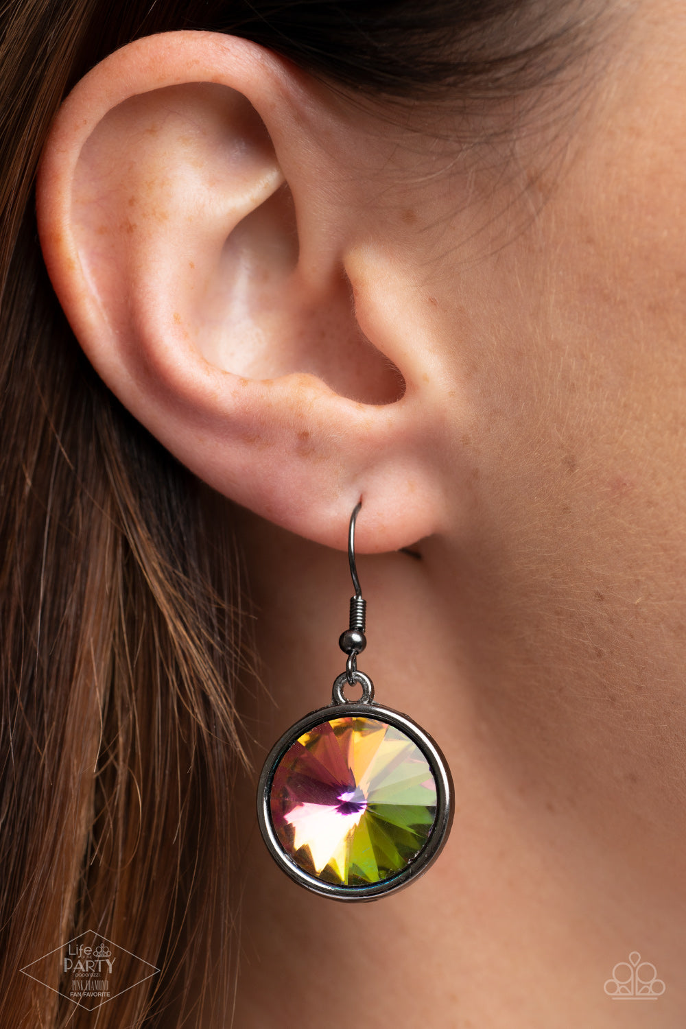 Hypnotized Multi Necklace - Paparazzi Accessories  Three dramatically oversized oil spill rhinestones are nestled into three textured gunmetal fittings that are connected by oval gunmetal rings, creating a brilliant statement piece. Features an adjustable clasp closure.  Sold as one individual necklace. Includes one pair of matching earrings. This Fan Favorite is back in the spotlight at the request of our 2021 Life of the Party member with Pink Diamond Access, NaKisha M.