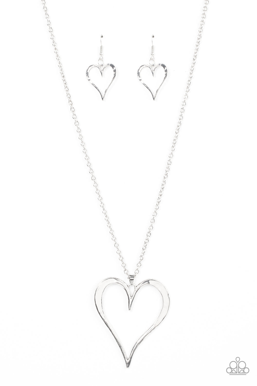 Hopelessly In Love Silver Necklace - Paparazzi Accessories  Featuring subtle hammered details, an oversized silver heart pendant swings from the bottom of a classic silver chain for a rustically romantic shimmer. Features an adjustable clasp closure.  Sold as one individual necklace. Includes one pair of matching earrings.