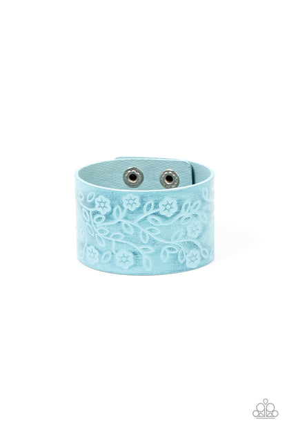Rosy Wrap Up Blue Bracelet - Paparazzi Accessories  A flowery and leafy motif blooms across the front of a distressed blue leather band, resulting in a rustic floral centerpiece around the wrist. Features an adjustable snap closure.  Sold as one individual bracelet.