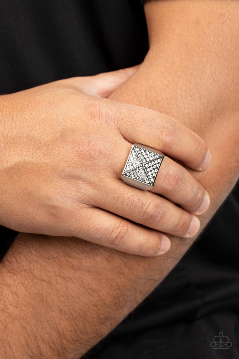 Encrusted in glassy white rhinestones, silver triangular frames build into a pyramidal centerpiece atop a thick silver band for a dauntless look. Features a stretchy band for a flexible fit.  Sold as one individual ring.