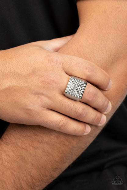 Encrusted in glassy white rhinestones, silver triangular frames build into a pyramidal centerpiece atop a thick silver band for a dauntless look. Features a stretchy band for a flexible fit.  Sold as one individual ring.