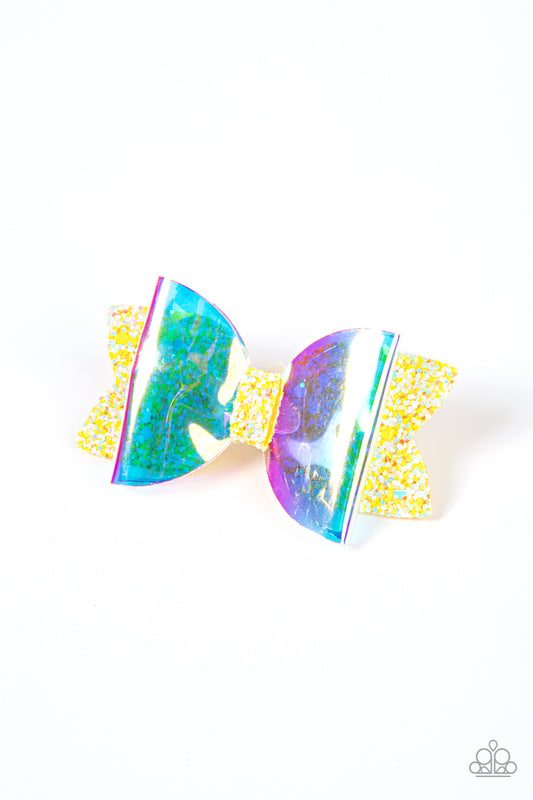 Futuristic Favorite Yellow Hair Clip - Paparazzi Accessories  An iridescent plastic bow is layered over a glittery yellow fabric cutout creating a shimmering futuristic vibe. Features a standard hair clip on the back.  Sold as one individual hair clip.