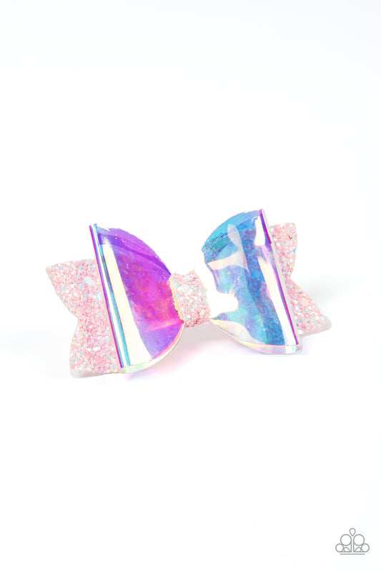Futuristic Favorite Pink Bow Hair Clip - Paparazzi Accessories  An iridescent plastic bow is layered over a glittery pink fabric cutout creating a shimmering futuristic vibe. Features a standard hair clip on the back.  Sold as one individual hair clip.