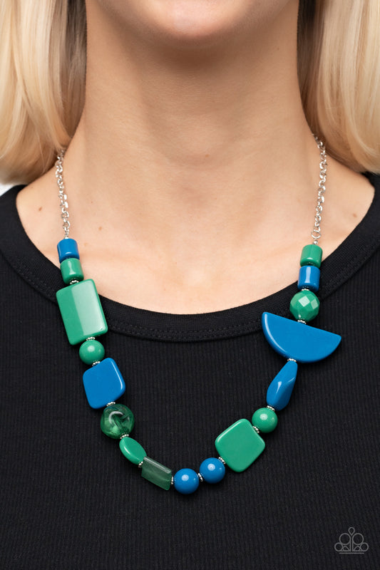 Tranquil Trendsetter Green Necklace - Paparazzi Accessories  Featuring the refreshing hues of Mykonos Blue and Leprechaun, mismatched acrylic and faux rock beads are haphazardly threaded along an invisible wire below the collar for an abstract artisan vibe. Features an adjustable clasp closure.  Sold as one individual necklace. Includes one pair of matching earrings.