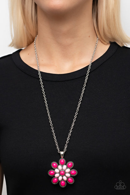 In the MEADOW of Nowhere Pink Necklace - Paparazzi Accessories  A bubbly collection of Fuchsia Fedora and Pale Rosette beads blooms into a vivacious flower pendant at the bottom of an extended silver chain, resulting in a flamboyant floral fashion. Features an adjustable clasp closure.  Sold as one individual necklace. Includes one pair of matching earrings.