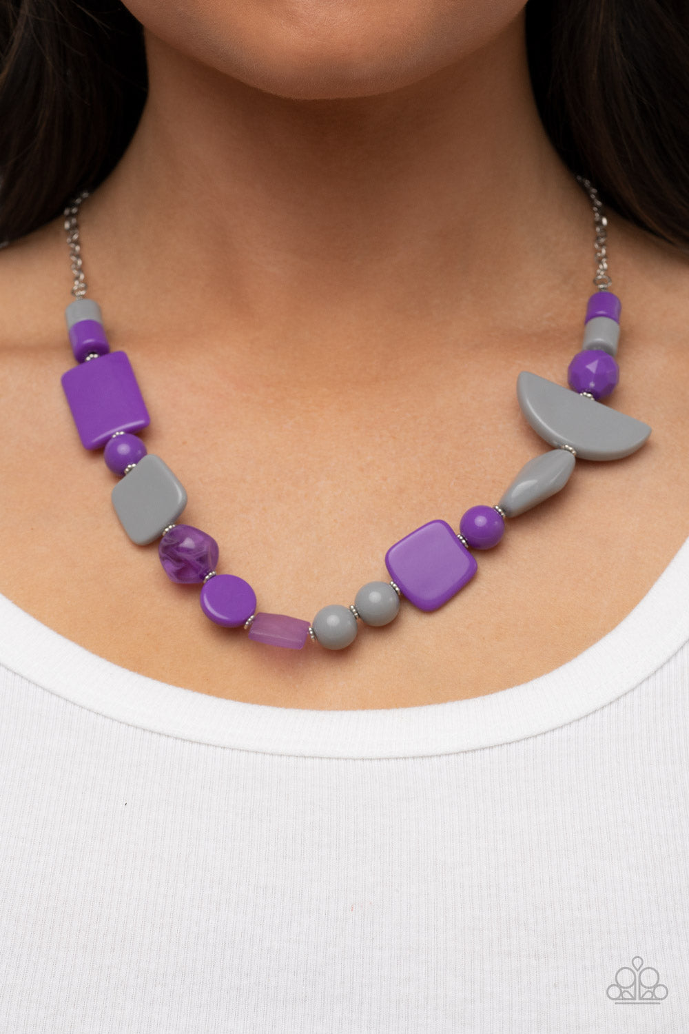 Tranquil Trendsetter Purple Necklace - Paparazzi Accessories  Featuring the bold hues of Ultimate Gray and purple, mismatched acrylic and faux rock beads are haphazardly threaded along an invisible wire below the collar for an abstract artisan vibe. Features an adjustable clasp closure.  Sold as one individual necklace. Includes one pair of matching earrings.