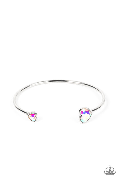 Unrequited Love Iridescent Heart Cuff Bracelet - Paparazzi Accessories  Enhanced with iridescent rhinestones, two silver hearts adorn the ends of a silver band that curls around the wrist for a flirtatious open-faced style cuff.  Sold as one individual bracelet.