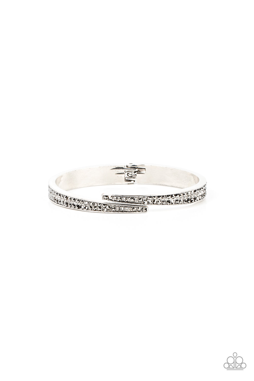 Deco Drama Silver Hinge Bracelet - Paparazzi Accessories  Encrusted in stacked sections of antiqued silver studs and smoky hematite rhinestones, two silver bars delicately overlap at the center of the wrist, resulting in an edgy cuff-like bangle. Features a hinged closure.  Sold as one individual bracelet.