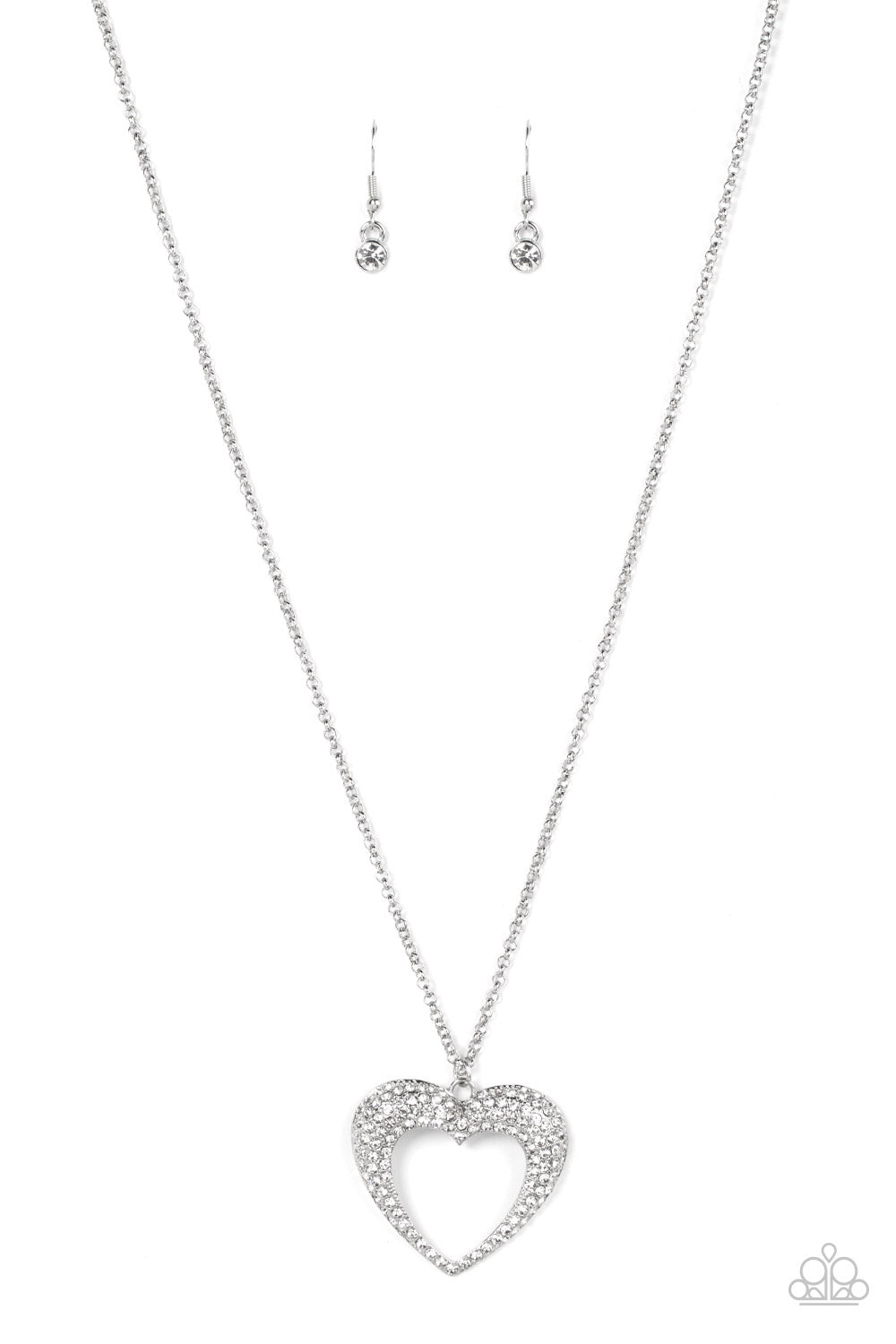 Cupid Charisma White Necklace - Paparazzi Accessories  A flared silver heart is encrusted in glassy white rhinestones, resulting in a romantic shimmer at the bottom of an extended silver chain. Features an adjustable clasp closure.  Sold as one individual necklace. Includes one pair of matching earrings.