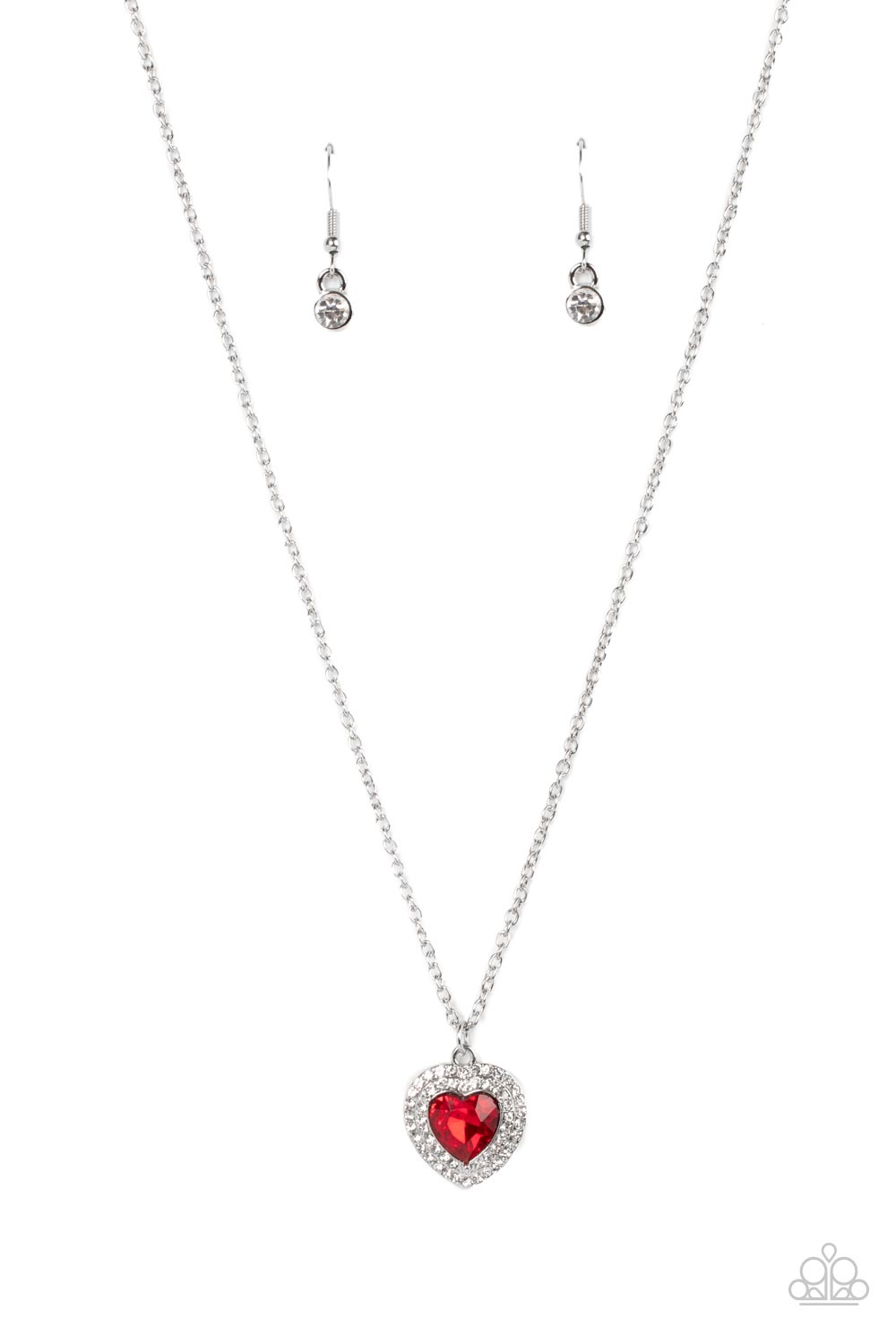 Taken with Twinkle Red Necklace - Paparazzi Accessories  Bordered in stacked rows of glassy white rhinestones, a fiery red heart shaped gem sparkles at the center of a dainty silver chain for a flirtatious fashion. Features an adjustable clasp closure.  Sold as one individual necklace. Includes one pair of matching earrings.