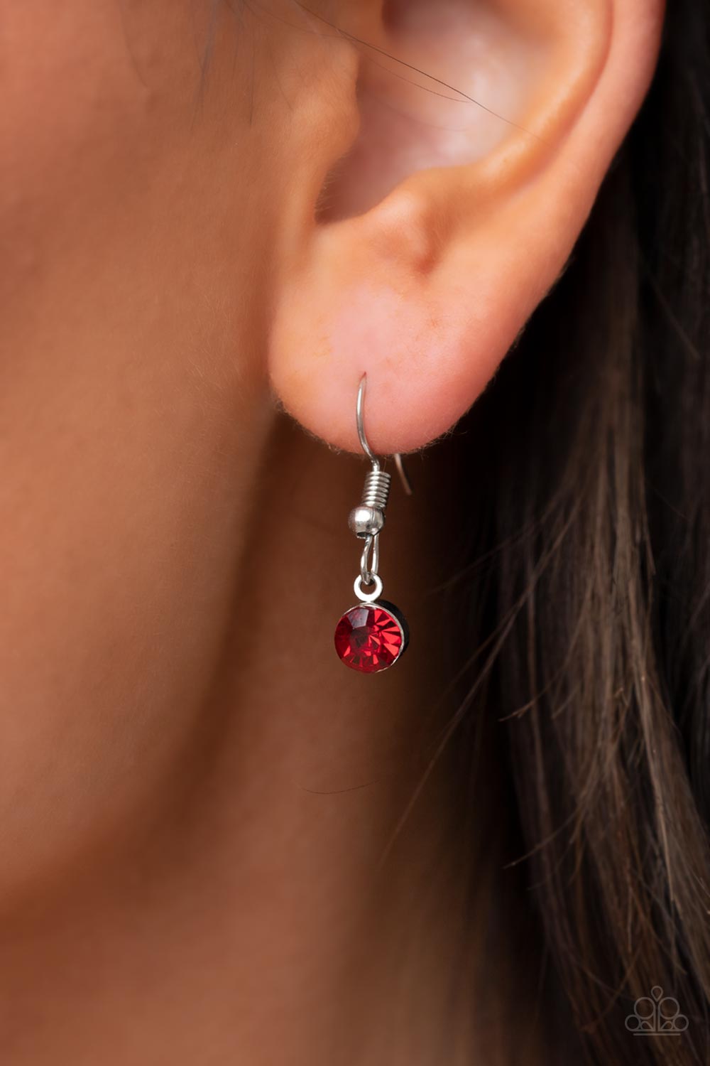 Taken with Twinkle Red Necklace - Paparazzi Accessories  Bordered in stacked rows of glassy white rhinestones, a fiery red heart shaped gem sparkles at the center of a dainty silver chain for a flirtatious fashion. Features an adjustable clasp closure.  Sold as one individual necklace. Includes one pair of matching earrings.