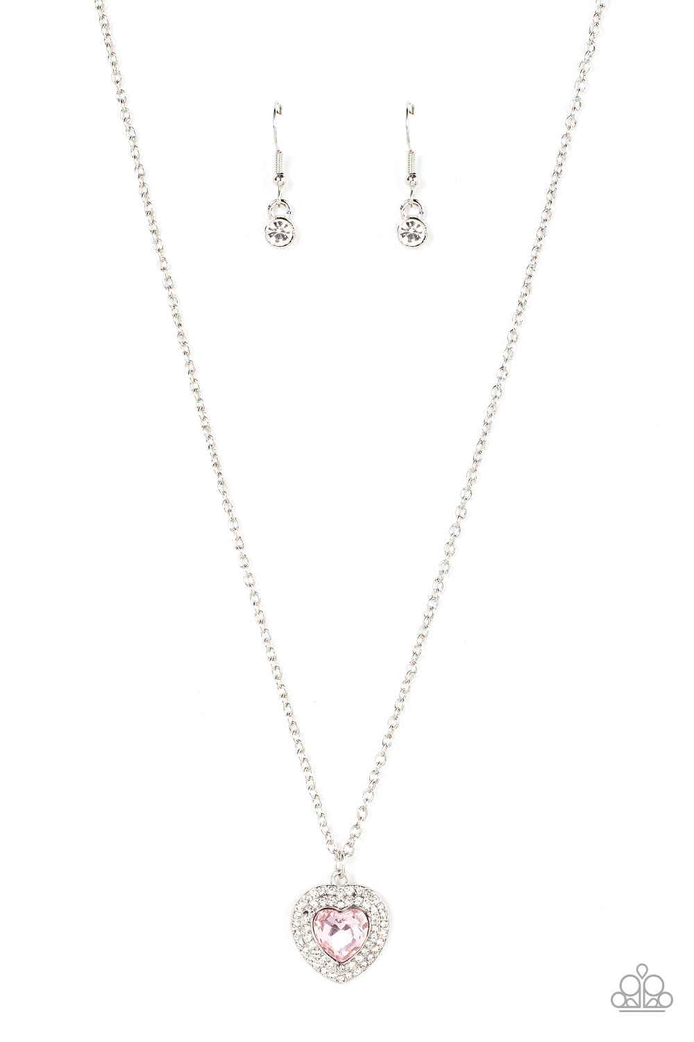 Taken with Twinkle Pink Heart Necklace - Paparazzi Accessories  Bordered in stack rows of glassy white rhinestones, a twinkly pink heart shaped gem sparkles at the center of a dainty silver chain for a flirtatious fashion. Features an adjustable clasp closure.  Sold as one individual necklace. Includes one pair of matching earrings.