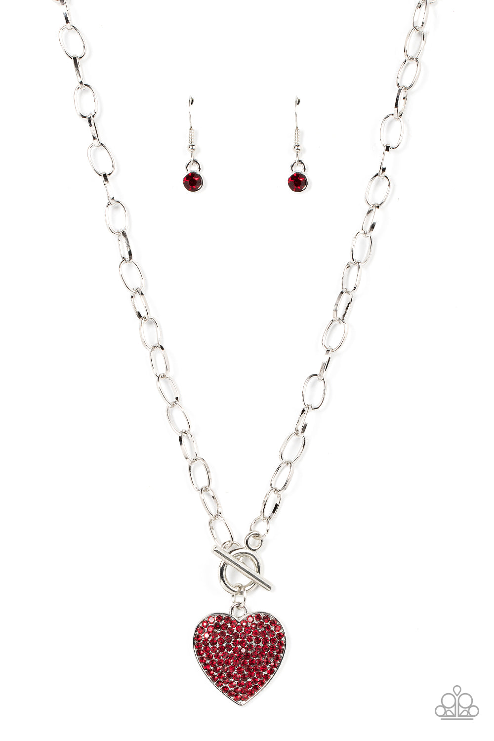 If You LUST Red Heart Necklace - Paparazzi Accessories  A fiery red rhinestone dotted silver heart frame sparkles from a toggle closure at the center of an oval silver linked chain for a flirtatious fashion. Features a toggle closure.  Sold as one individual necklace. Includes one pair of matching earrings.