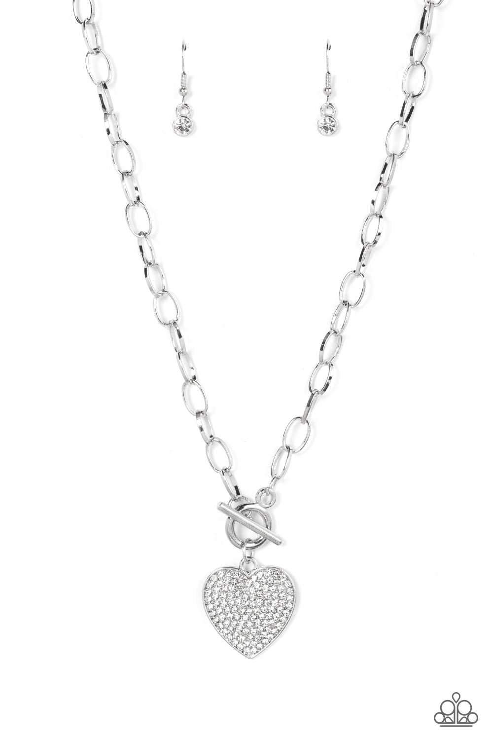 If You LUST White Necklace - Paparazzi Accessories  A white rhinestone dotted silver heart frame sparkles from a toggle closure at the center of an oval silver linked chain for a flirtatious fashion. Features a toggle closure.  Sold as one individual necklace. Includes one pair of matching earrings.