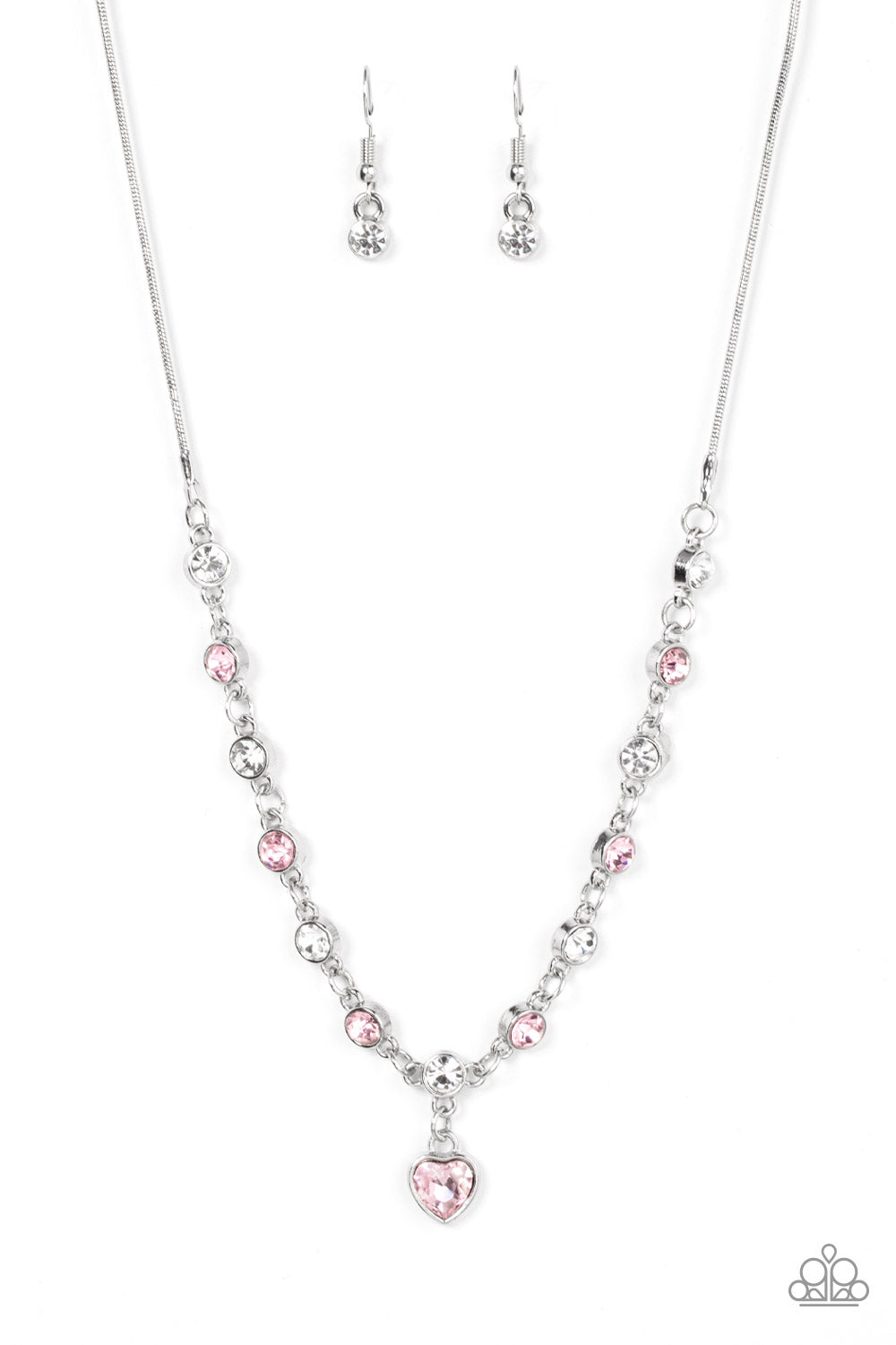 True Love Trinket Pink Necklace & Bracelet Set - Paparazzi Accessories A pink rhinestone heart charm dances from a strand of white and pink rhinestones, resulting in a flirtatious sparkle below the collar and around the wrist. Sold as one individual necklace. Includes one matching bracelet. Get The Complete Look! Bracelet: "Truly Lovely - Pink"