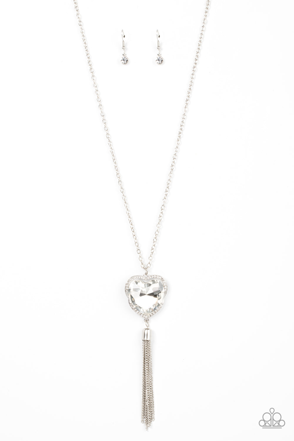 Finding My Forever White Heart Necklace - Paparazzi Accessories  Bordered in a ribbon of glassy white rhinestones, an oversized white heart-shaped gem seemingly floats at the bottom of an extended silver chain. A shimmery silver chain tassel dances from the bottom of the sparkly pendant for a flirtatious finish. Features an adjustable clasp closure.  Sold as one individual necklace. Includes one pair of matching earrings.
