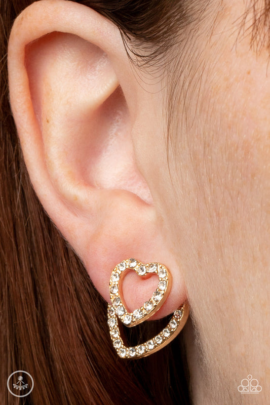Ever Enamored Gold Jacket Earring - Paparazzi Accessories  A dainty gold heart dotted in glassy white rhinestones flirtatiously attaches to a double-sided post, while a slightly larger white rhinestone encrusted gold heart peeks out beneath the ear for a romantic finish. Earring attaches to a standard post fitting.  Sold as one pair of double-sided post earrings.