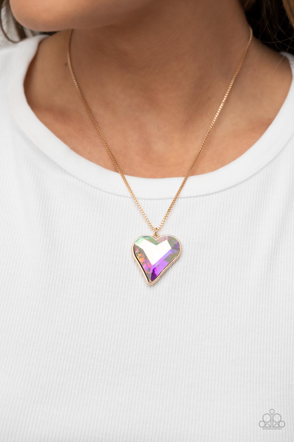 Lockdown My Heart Gold Necklace - Paparazzi Accessories  An iridescent heart-shaped gem is pressed into a simple gold frame at the end of a gold box chain creating an adorable sentiment below the collar. Features an adjustable clasp closure.  Sold as one individual necklace. Includes one pair of matching earrings.