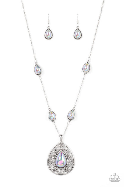 Magical Masquerade Silver Necklace - Paparazzi Accessories  Brushed in an iridescent finish, a silvery teardrop bead is pressed into the center of an oversized silver teardrop frame that is bursting with vine-like filigree. Infused with matching teardrop beaded frames, the ethereal pendant glides along the beaded silver chain for a magical finish. Features an adjustable clasp closure.  Sold as one individual necklace. Includes one pair of matching earrings.