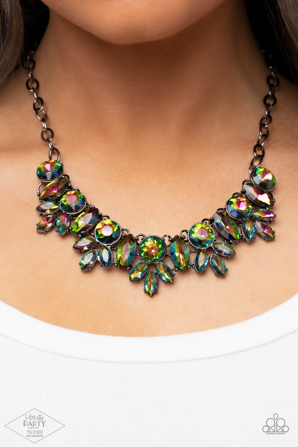Combustible Charisma Multi Necklace - Paparazzi Accessories  A blinding series of oversized round and marquise style oil spill rhinestones dramatically link below the collar, creating a show-stopping statement piece. Features an adjustable clasp closure.  Sold as one individual necklace. Includes one pair of matching earrings. This Fan Favorite is back in the spotlight at the request of our 2021 Life of the Party member with Pink Diamond Access, Jennifer V.
