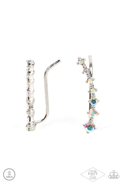 New Age Nebula Multi Ear Crawler - Paparazzi Accessories  Gradually decreasing in size, a dainty row of glittery iridescent rhinestones curve up the ear for a stellar chic look.  Sold as one pair of ear crawlers. This Fan Favorite is back in the spotlight at the request of our 2021 Life of the Party member with Pink Diamond Access, Awnya B.