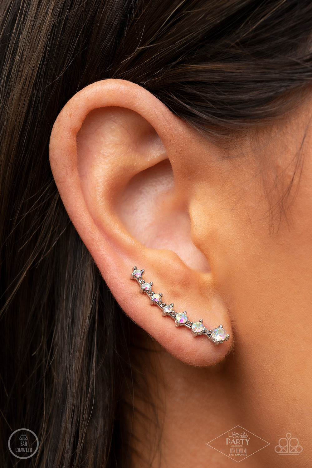 New Age Nebula Multi Ear Crawler - Paparazzi Accessories  Gradually decreasing in size, a dainty row of glittery iridescent rhinestones curve up the ear for a stellar chic look.  Sold as one pair of ear crawlers. This Fan Favorite is back in the spotlight at the request of our 2021 Life of the Party member with Pink Diamond Access, Awnya B.
