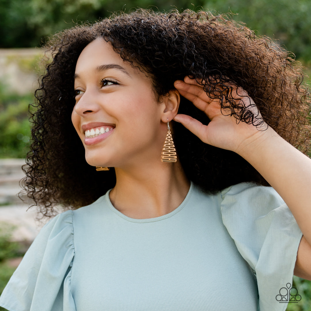 Urban Delirium Brown Leather Earring - Paparazzi Accessories  Featuring an edgy geometric cutout pattern, a stretchy piece of brown leather-like fabric delicately folds in half as it connects into a trendy frame. Earring attaches to a standard fishhook fitting.  Sold as one pair of earrings.
