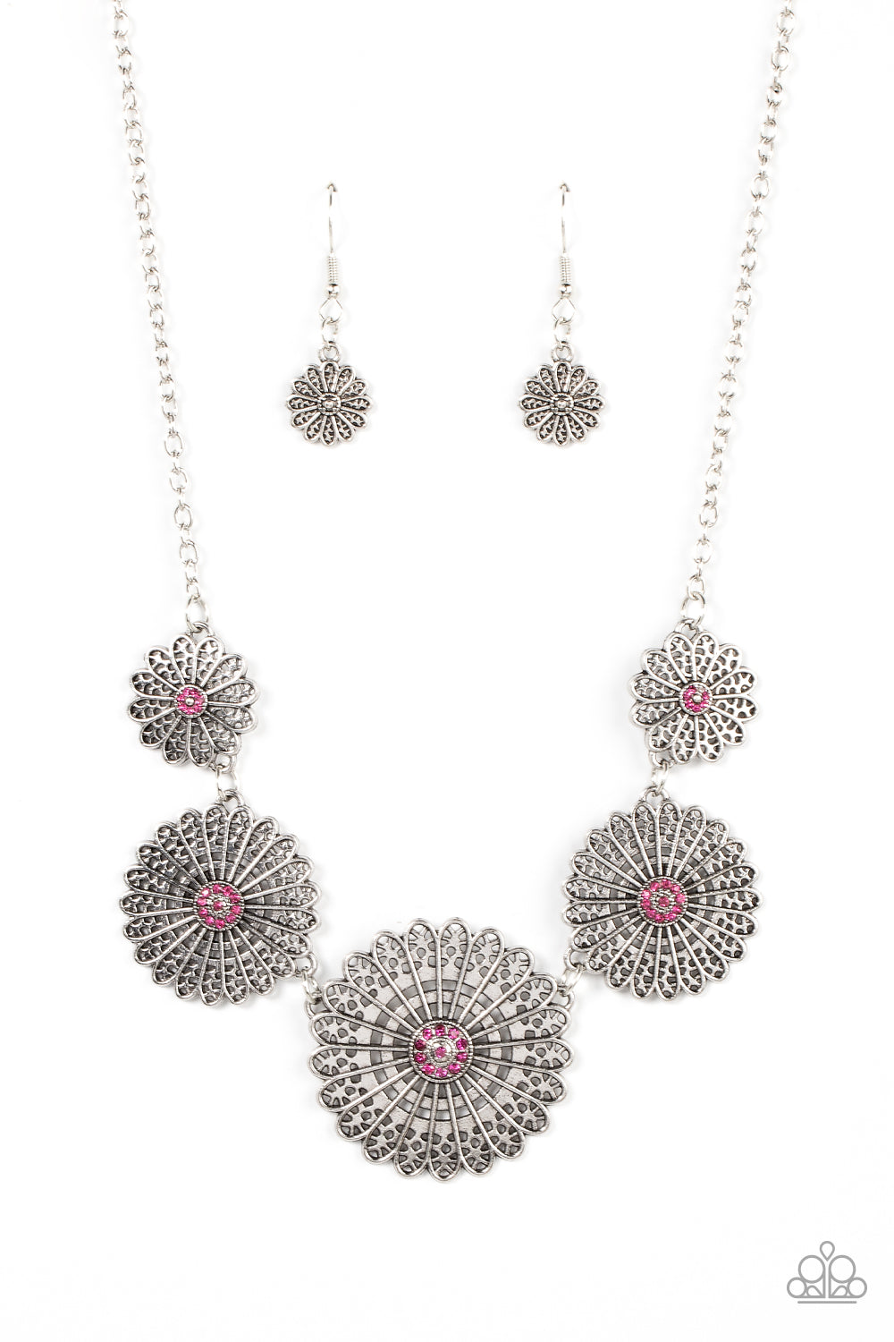 Marigold Meadows Pink Necklace - Paparazzi Accessories  Infused with a whimsical mandala-like motif, tactile silver petals bloom from pink rhinestone dotted centers below the collar. The mismatched silver flowers gradually increase in size, exaggerating the eye-catching details. Features an adjustable clasp closure.  Sold as one individual necklace. Includes one pair of matching earrings.