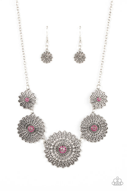 Marigold Meadows Pink Necklace - Paparazzi Accessories  Infused with a whimsical mandala-like motif, tactile silver petals bloom from pink rhinestone dotted centers below the collar. The mismatched silver flowers gradually increase in size, exaggerating the eye-catching details. Features an adjustable clasp closure.  Sold as one individual necklace. Includes one pair of matching earrings.
