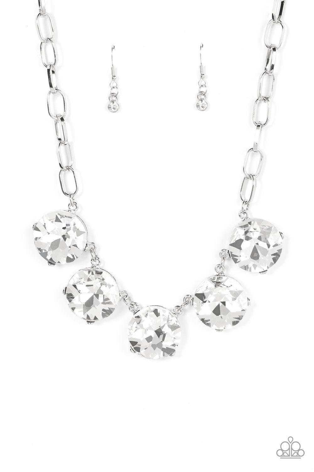 Limelight Luxury White Necklace - Paparazzi Accessories  Set in silver pronged fittings, five dramatically oversized brilliant white rhinestones connect across the collar and attach to an oversized silver chain creating a stunning spot-light loving statement piece. Features an adjustable clasp closure.  Sold as one individual necklace. Includes one pair of matching earrings.