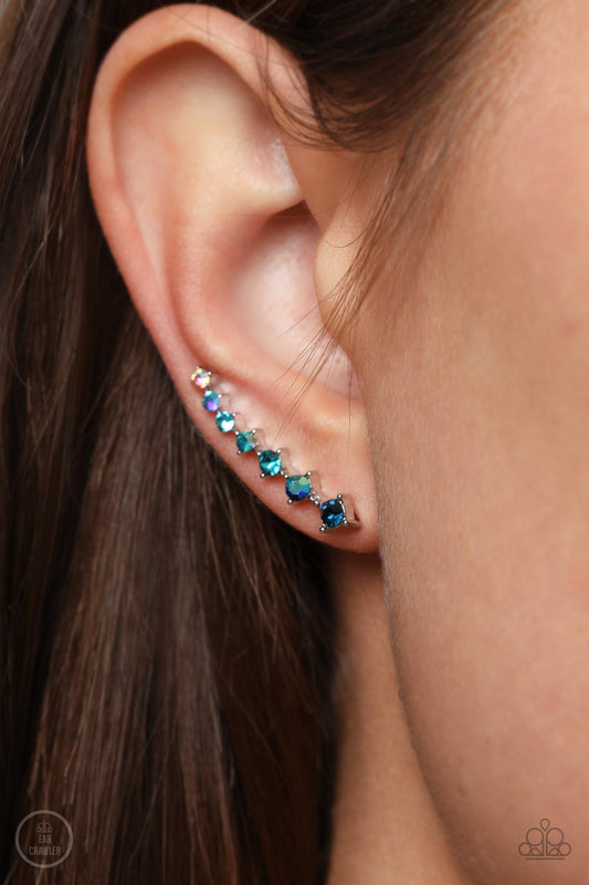 STARLIGHT Show Blue Ear Crawler Earring - Paparazzi Accessories  An iridescent spectrum of dainty blue rhinestones gradually increase in intensity as they climb the ear for a stellar fashion. Features an extended post fitting that climbs the back of the ear and can be pressed together for a more secure fit.  Sold as one pair of ear crawlers.