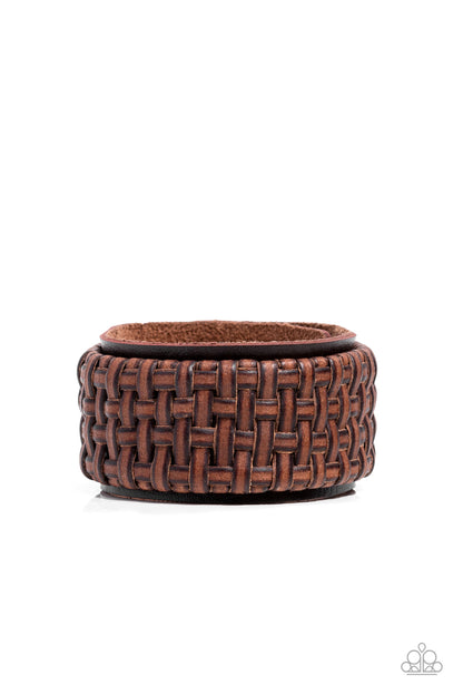 Urban Expansion Brown Wrap Bracelet - Paparazzi Accessories   Distressed leather laces weave into a wicker-like pattern, creating a thick band of texture that wraps around a leather band. The textured overlay is studded in place across the front of the brown leather band, resulting in a rustic centerpiece. Features an adjustable snap closure.  Sold as one individual bracelet.