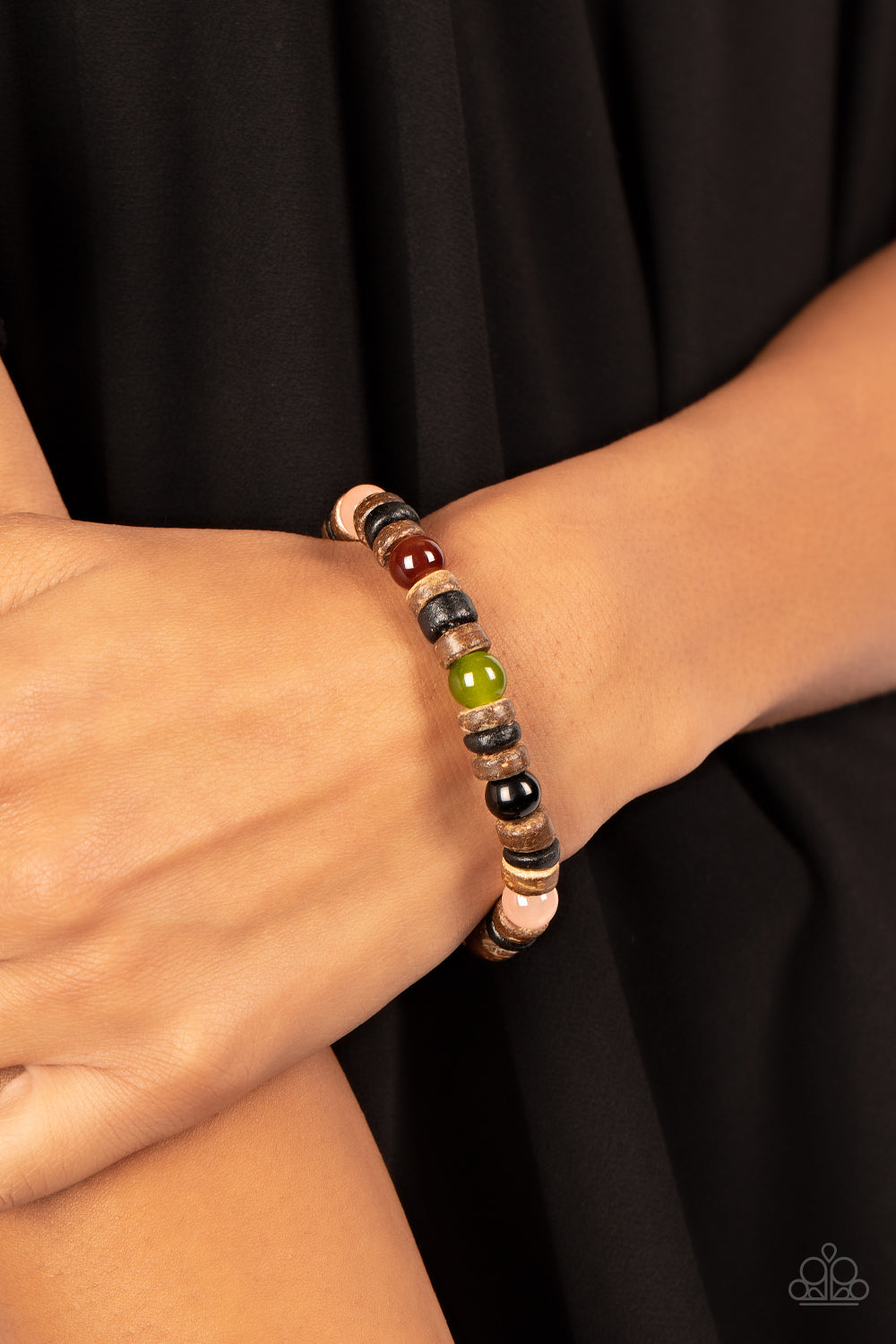 Durango Drifter Multi Bracelet - Paparazzi Accessories  Glassy multicolored stone beads join trios of black and brown wooden discs along stretchy bands around the wrist, resulting in an earthy pop of color.  Sold as one individual bracelet.