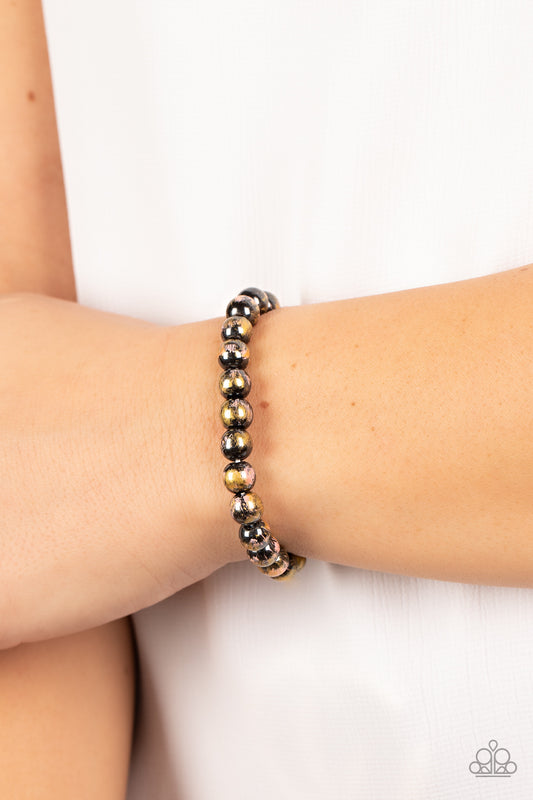 Astro Artistry Pink Bracelet - Paparazzi Accessories  Speckled in gold and pink paint, shiny gunmetal beads are threaded along stretchy bands around the wrist for a stellar effect.  Sold as one individual bracelet.