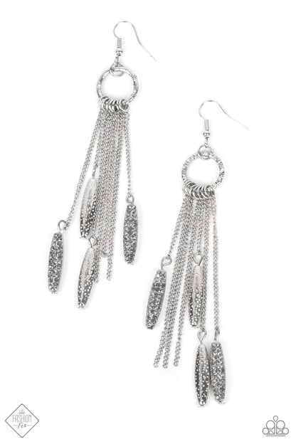 Thrifty Tassel Silver Earring - Paparazzi Accessories  A small circle finished with a serrated texture gives way to a flirty fringe of dainty chains and metallic accents. The metallic accents are encrusted in dainty hematite rhinestones and dotted texture, creating a sassy lure. Earring attaches to a standard fishhook fitting.  Sold as one pair of earrings.