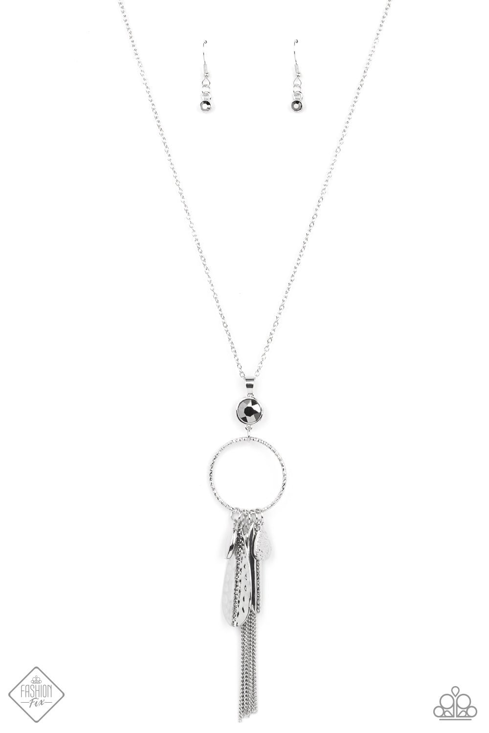 Tastefully Tasseled Silver Necklace - Paparazzi Accessories  Featuring both smooth and hammered finishes, dainty smoky rhinestones, and a tassel of dainty chains, a sassy collection of silver charms swings from the bottom of a brightly textured circle. A faceted hematite gem sits atop the harmoniously audacious display at the bottom of a lengthened dainty silver chain for a crowning finish. Features an adjustable clasp closure.  Sold as one individual necklace. Includes one pair of matching earrings.