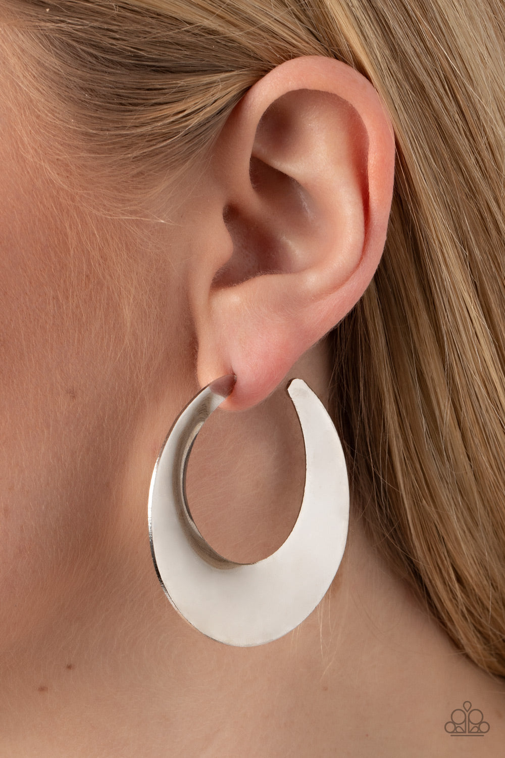 Power Curves Silver Hoop Earring - Paparazzi Accessories  A flat silver hoop widens and bevels at the center, curving into a dramatic shimmer. Earring attaches to a standard post fitting. Hoop measures approximately 2" in diameter.  Sold as one pair of hoop earrings.