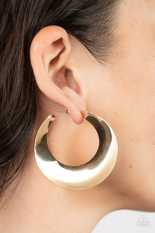 Power Curves Gold Hoop Earring - Paparazzi Accessories  A flat gold hoop widens and bevels at the center, curving into a dramatic shimmer. Earring attaches to a standard post fitting. Hoop measures approximately 2" in diameter.  Sold as one pair of hoop earrings.
