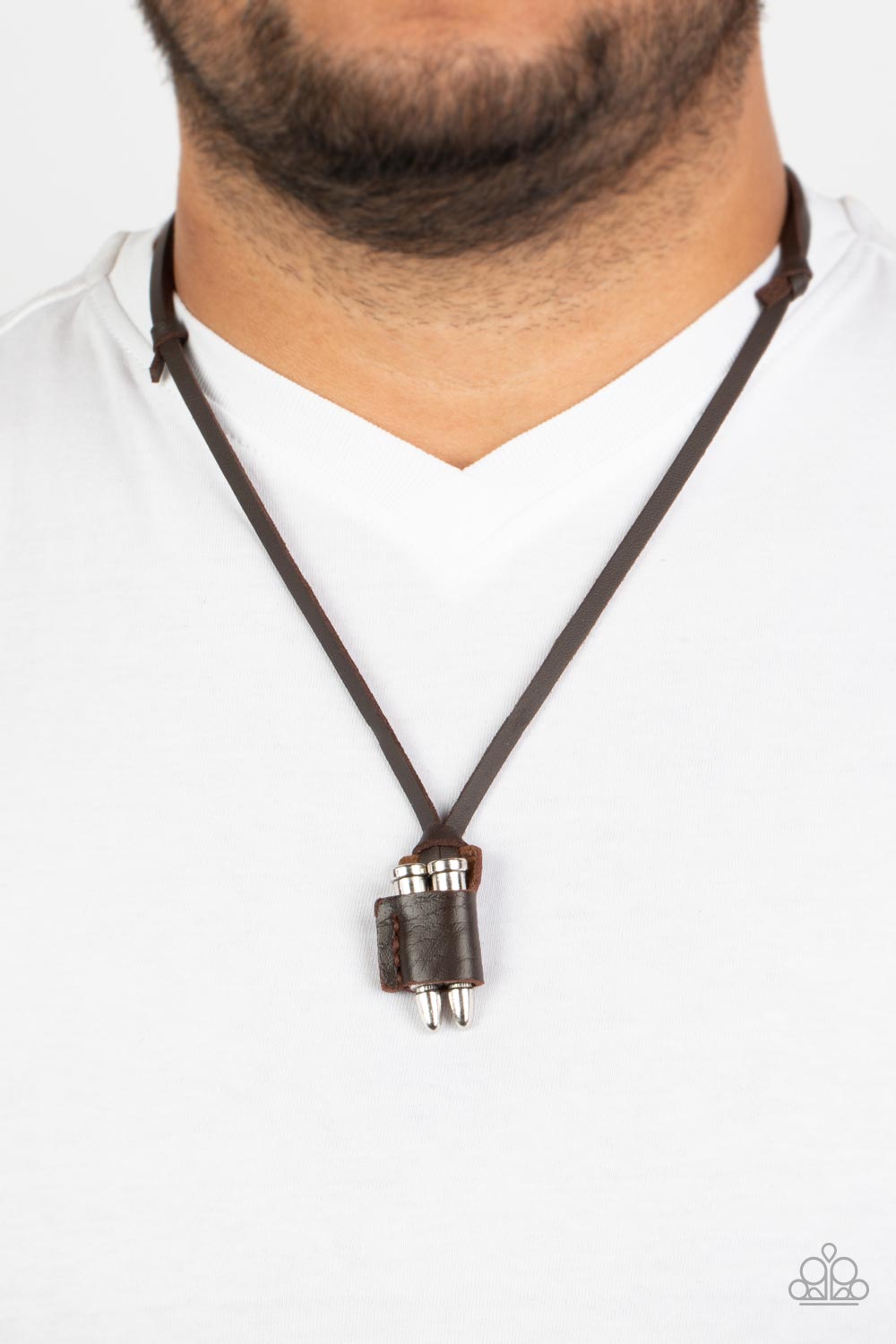On the Lookout Brown Unisex Necklace - Paparazzi Accessories  A piece of brown leather wraps around a pair of silver bullets, creating an edgy urban pendant at the bottom of knotted strands of brown leather. Features an adjustable sliding knot closure.  Sold as one individual necklace.