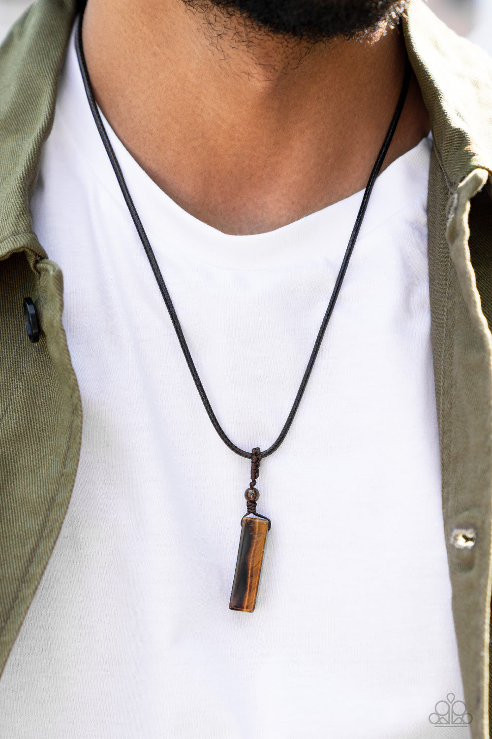 Comes Back ZEN-fold Brown Urban Necklace - Paparazzi Accessories  A rectangular tiger's eye stone pendulum is knotted in place below a dainty tiger's eye stone bead that glides along a shiny brown cord below the collar, resulting in an earthy pendant. Features an adjustable sliding knot closure.  Sold as one individual necklace.