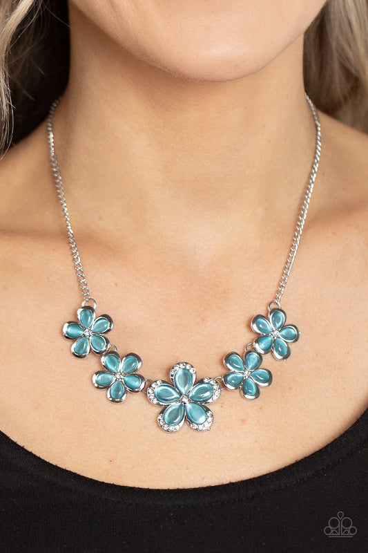 Garden Daydream Blue Necklace - Paparazzi Accessories  Bordered in silver accents, dainty blue cat's eye stone petals bloom from dainty white rhinestone centers, linking into ethereal blossoms below the collar. The centermost daisy is dotted in glassy white rhinestones, adding dazzling dimension to the floral fairytale. Features an adjustable clasp closure.  Sold as one individual necklace. Includes one pair of matching earrings.  P2RE-BLXX-375XX