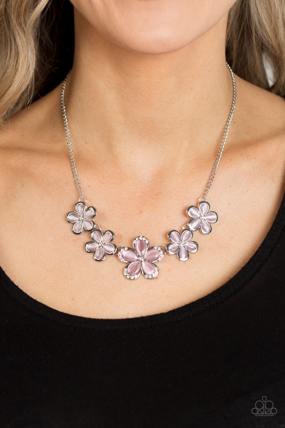 Garden Daydream Pink Necklace - Paparazzi Accessories  Bordered in silver accents, dainty pink cat's eye stone petals bloom from dainty white rhinestone centers, linking into ethereal blossoms below the collar. The centermost daisy is dotted in glassy white rhinestones, adding dazzling dimension to the floral fairytale. Features an adjustable clasp closure.  Sold as one individual necklace. Includes one pair of matching earrings.  P2RE-PKXX-361XX